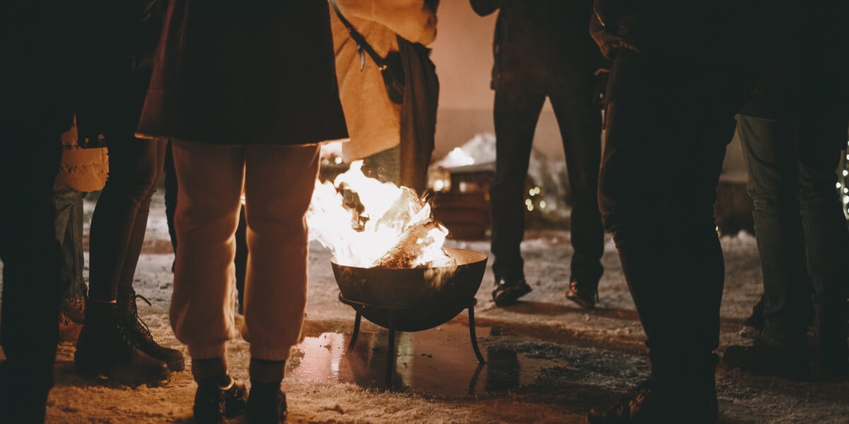 IceFire members warming up by the fire