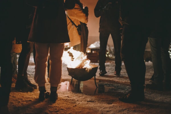 IceFire members warming up by the fire