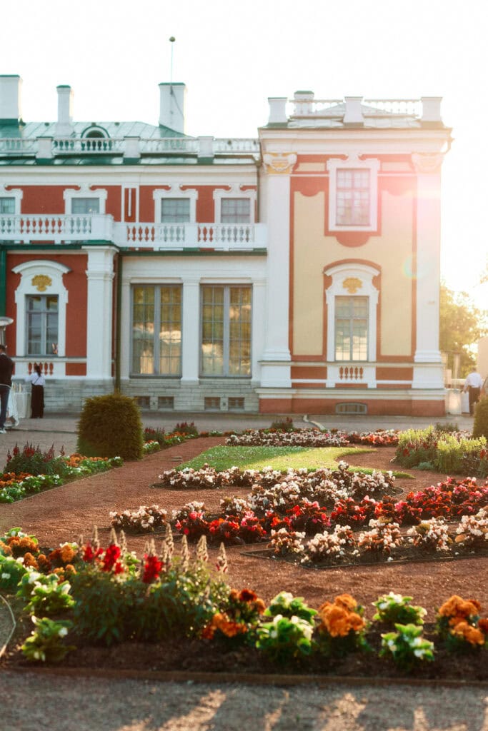 Kadriorg Castle with the warm glow of the setting sun in the background.