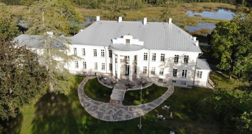 Aerial front view of Kernu Manor on a sunny day.